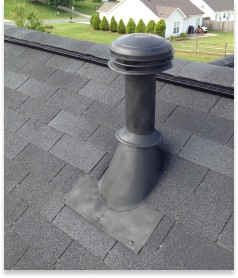 view of a finished keyway contruction roof and shingle replacement on top of home near chimney