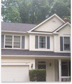 yellow and blue home with new roof from keyway construction