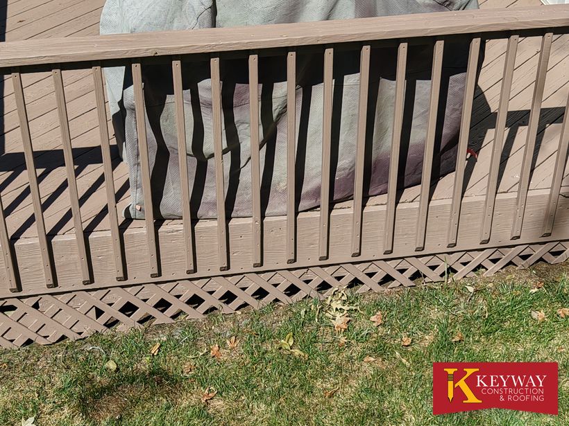 Refinished wood deck railing detail on a Charlotte, NC home