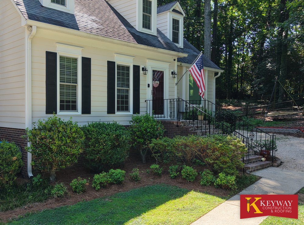 Well-maintained cream lap siding on a Charlotte-area home, an example of quality siding installed by Keyway