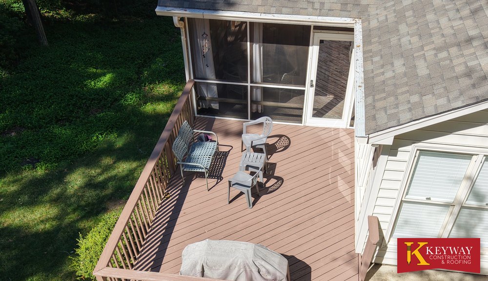 Wood deck and screened porch with railings on a Charlotte-area home, the kind of exterior woodwork Keyway repairs and rebuilds
