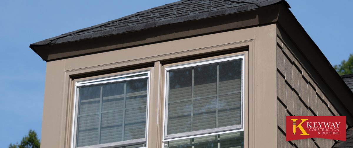 Dormer with new trim and shake style siding