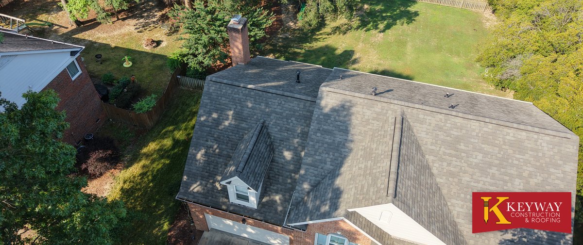 Aerial view of a brick Matthews NC home after a Keyway roof replacement